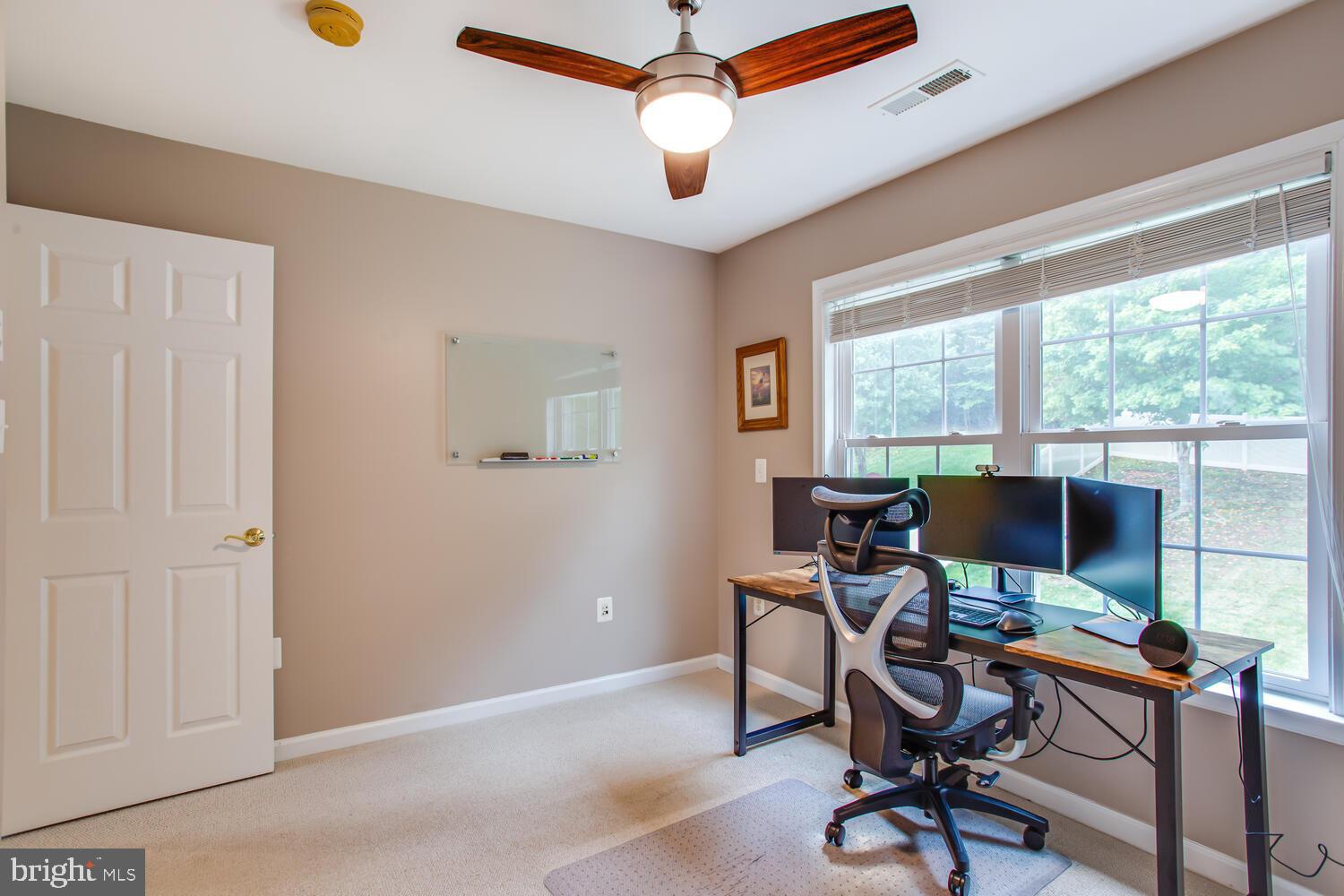 3403 Logstone Drive Triangle, VA 22172 - Photo 41 of 66 a view of a workspace with furniture and a window