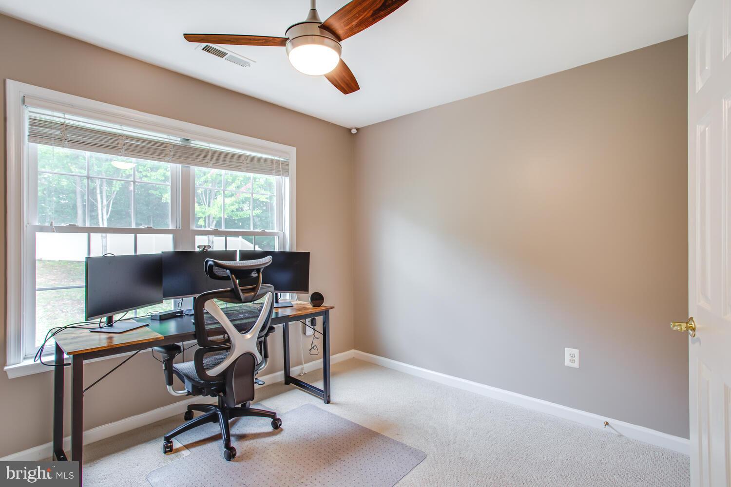 3403 Logstone Drive Triangle, VA 22172 - Photo 42 of 66 a view of a workspace with furniture and a window