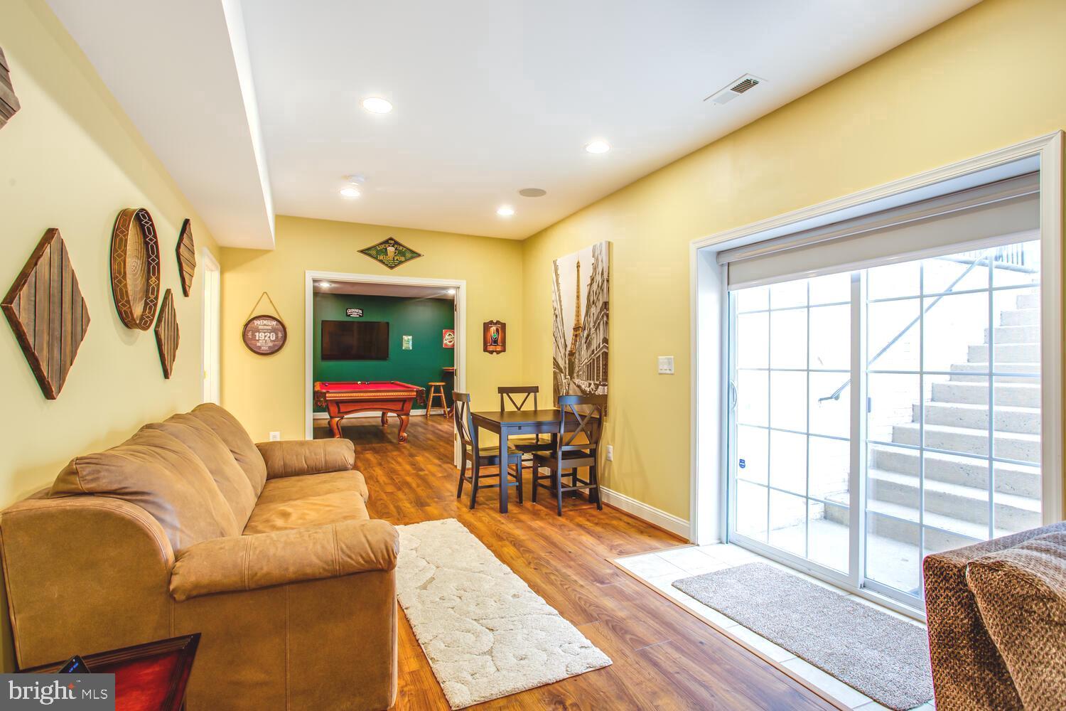 3403 Logstone Drive Triangle, VA 22172 - Photo 51 of 66 a living room with furniture and wooden floor