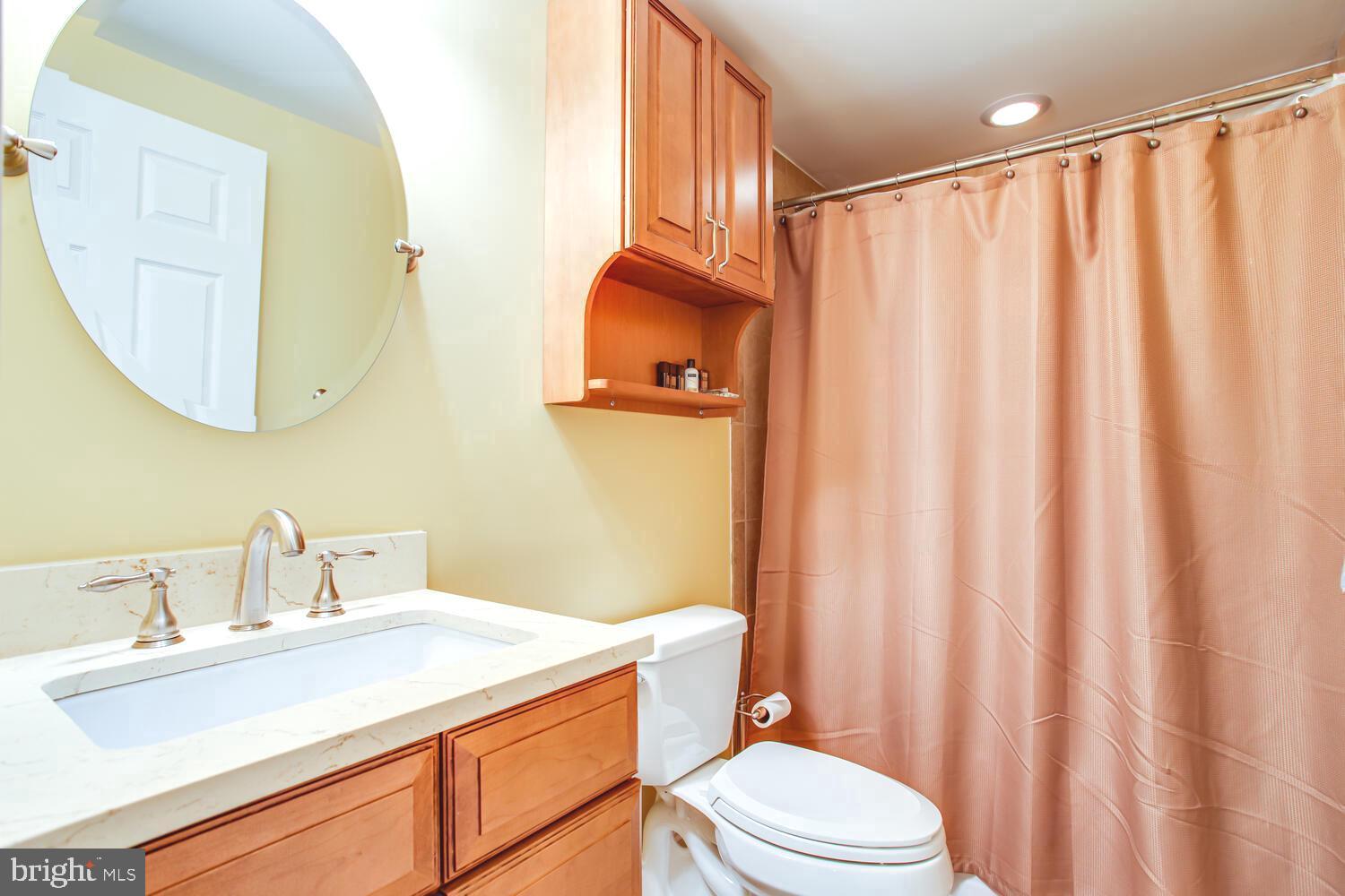 3403 Logstone Drive Triangle, VA 22172 - Photo 55 of 66 a bathroom with a sink a toilet and a mirror