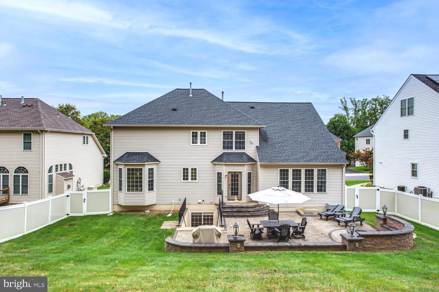 3403 Logstone Drive Triangle, VA 22172 - Photo 58 of 66 a front view of a house with a garden and yard