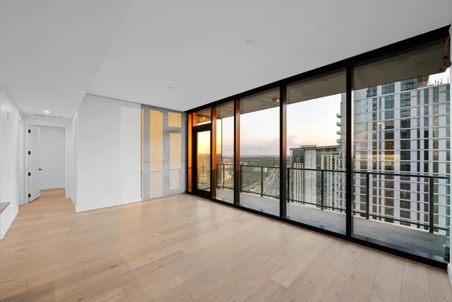 a view of an empty room with windows