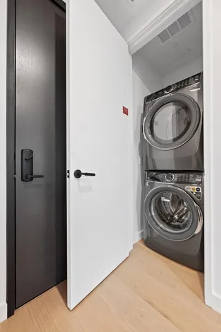 a utility room with sink dryer and washer