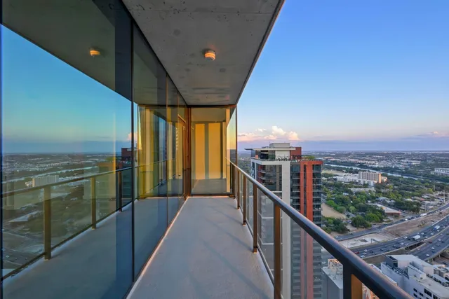 a view of a balcony with city view