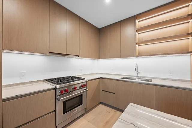a kitchen with a sink and cabinets
