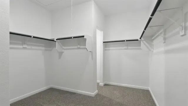 a bathroom with a double vanity sink and mirror