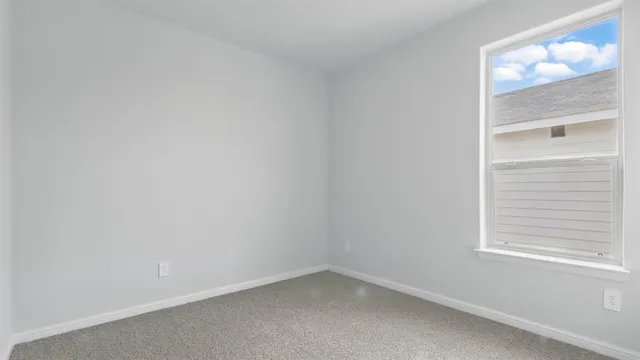 an empty room with closet area