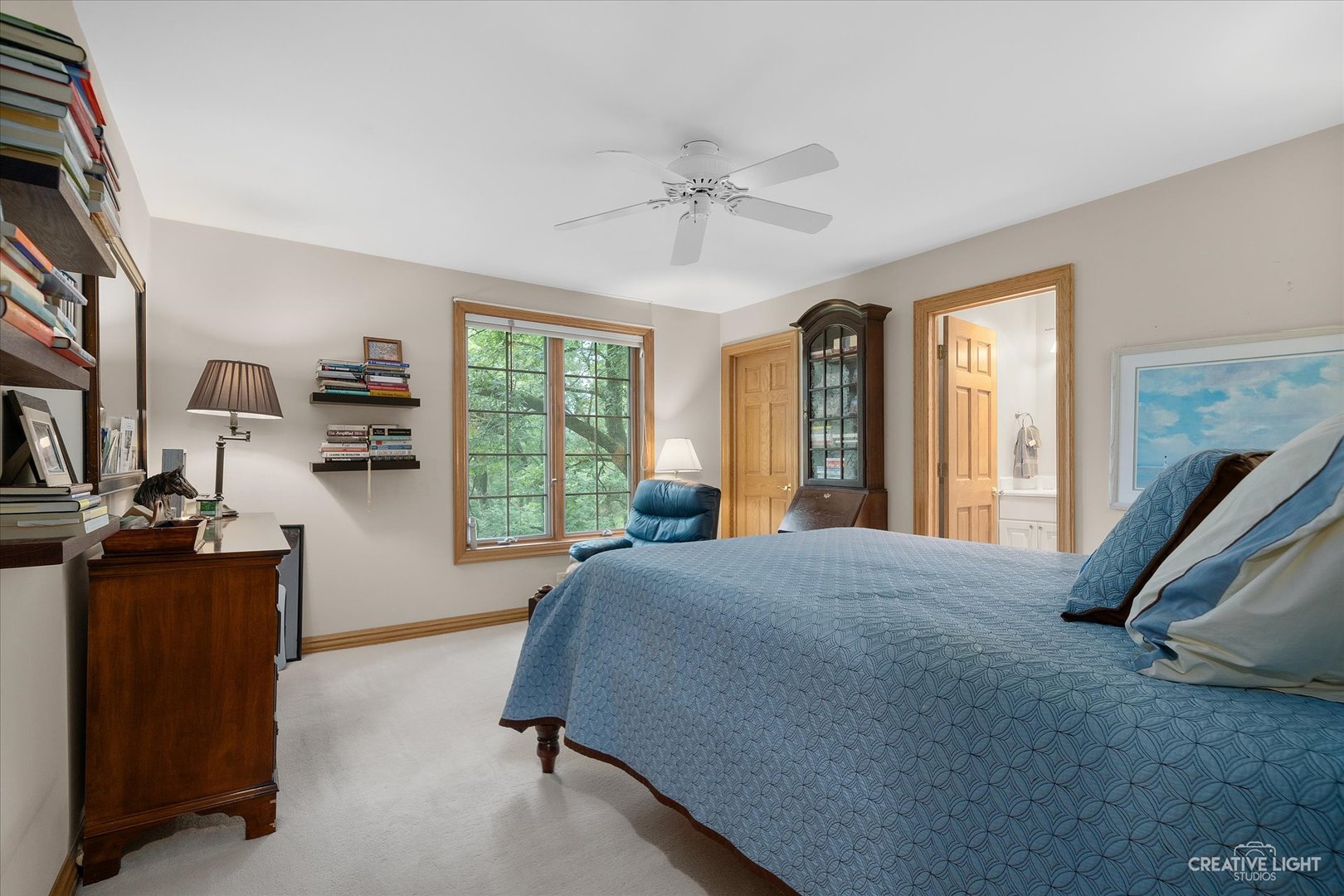 3293 Oak Knoll Road Carpentersville, IL 60110 - Photo 22 of 44 a bedroom with a bed a dresser and large window