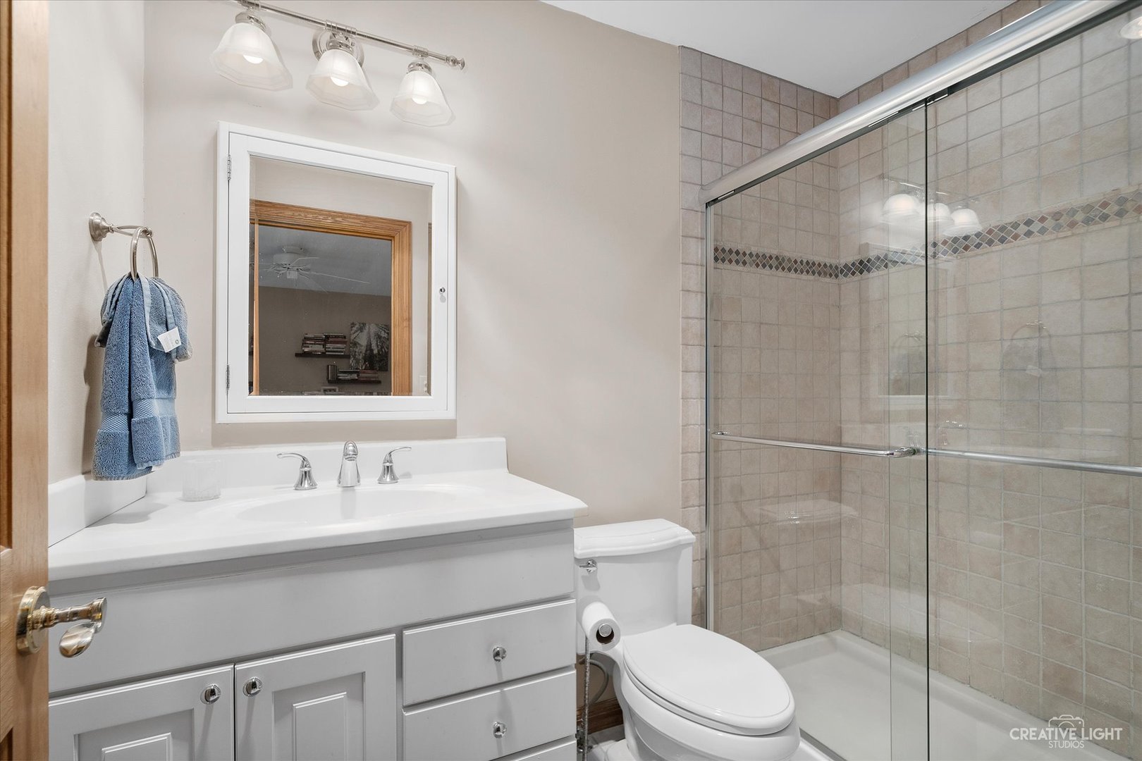 3293 Oak Knoll Road Carpentersville, IL 60110 - Photo 23 of 44 a bathroom with a sink a toilet and shower