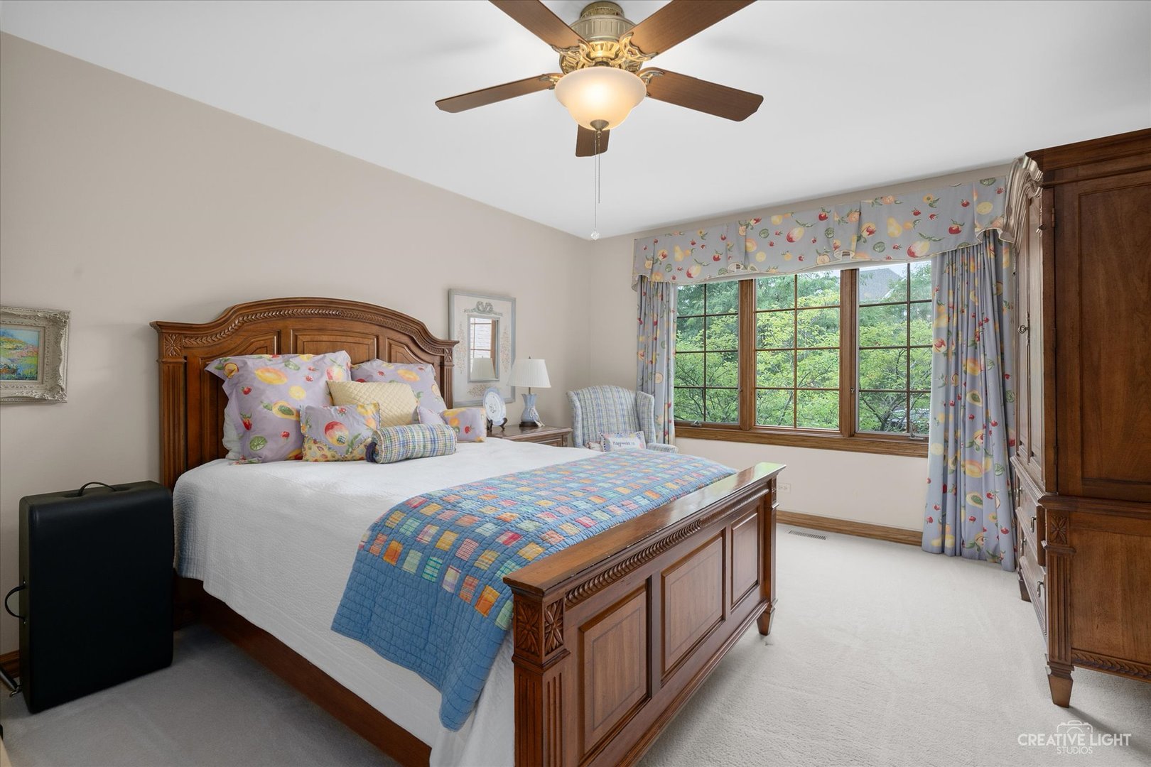 3293 Oak Knoll Road Carpentersville, IL 60110 - Photo 24 of 44 a bedroom with a bed next to a window