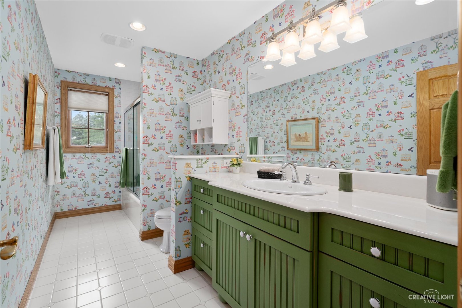 3293 Oak Knoll Road Carpentersville, IL 60110 - Photo 25 of 44 a bathroom with a sink double vanity and a mirror