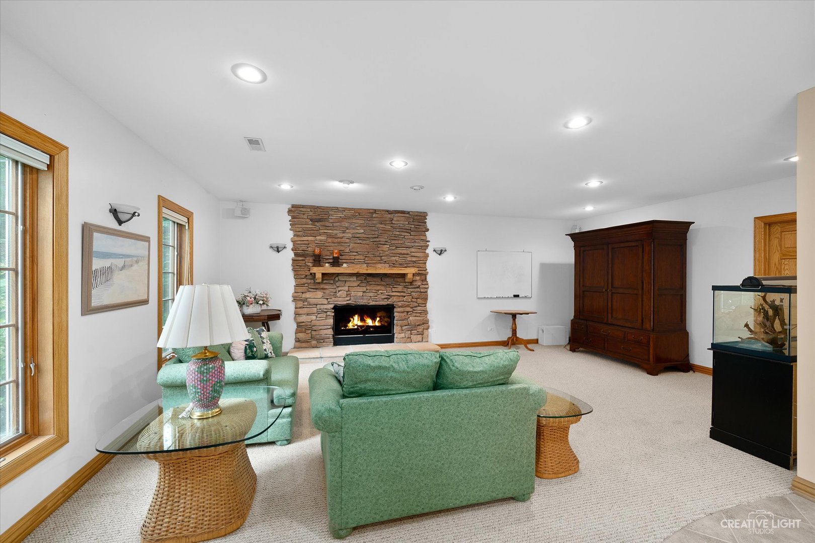 3293 Oak Knoll Road Carpentersville, IL 60110 - Photo 30 of 44 a living room with furniture and a fireplace