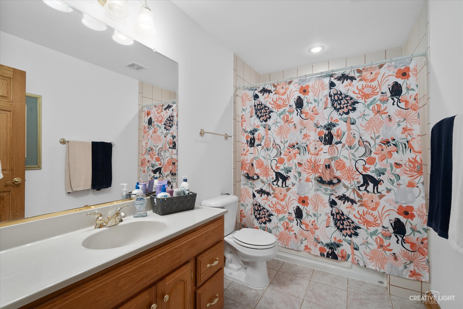 3293 Oak Knoll Road Carpentersville, IL 60110 - Photo 32 of 44 a bathroom with a sink toilet and shower