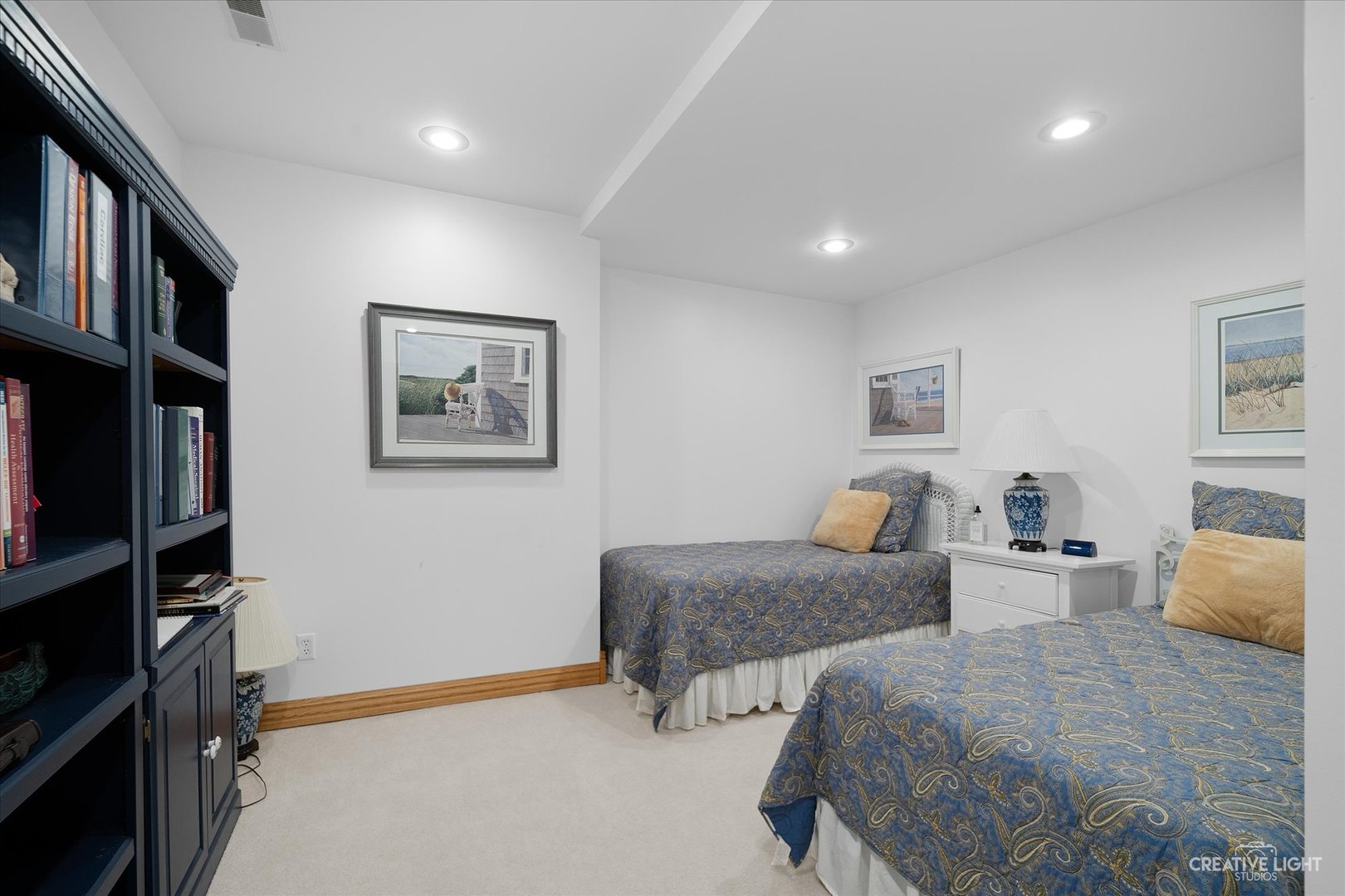 3293 Oak Knoll Road Carpentersville, IL 60110 - Photo 34 of 44 a bedroom with two beds and a book shelf