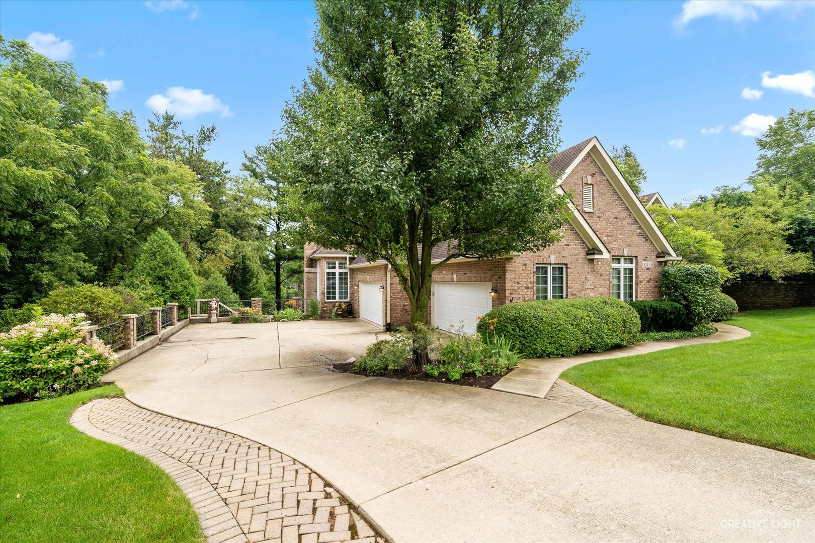 3293 Oak Knoll Road Carpentersville, IL 60110 - Photo 35 of 44 a front view of a house with a yard and trees
