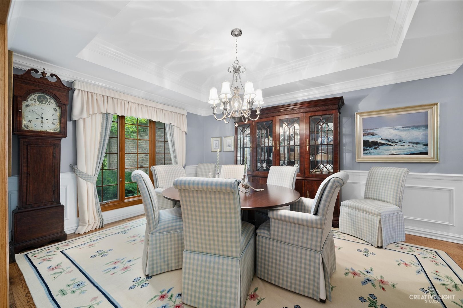 3293 Oak Knoll Road Carpentersville, IL 60110 - Photo 4 of 44 a dining room with furniture a rug and a chandelier