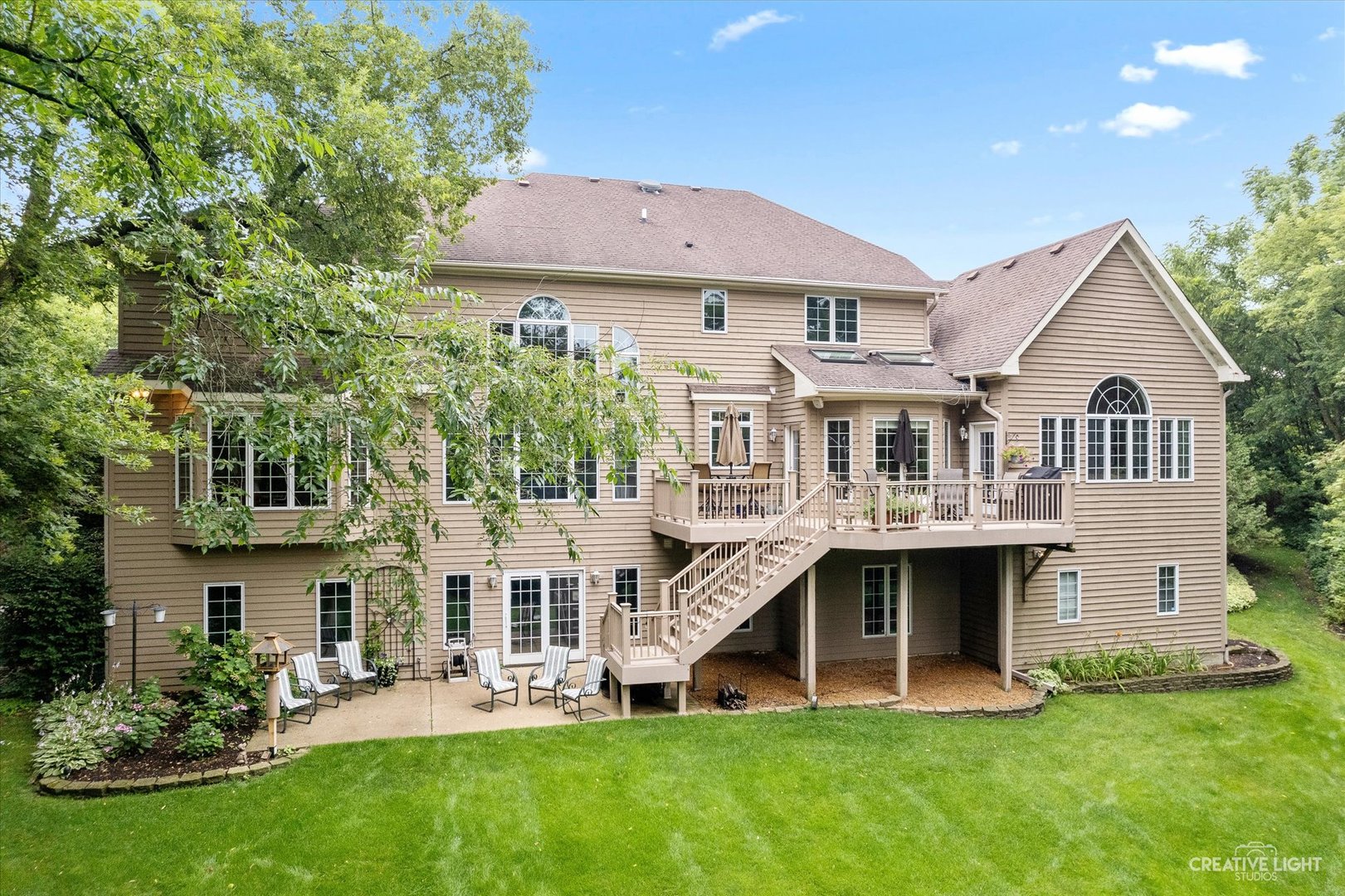 3293 Oak Knoll Road Carpentersville, IL 60110 - Photo 41 of 44 a front view of a house with a yard and trees