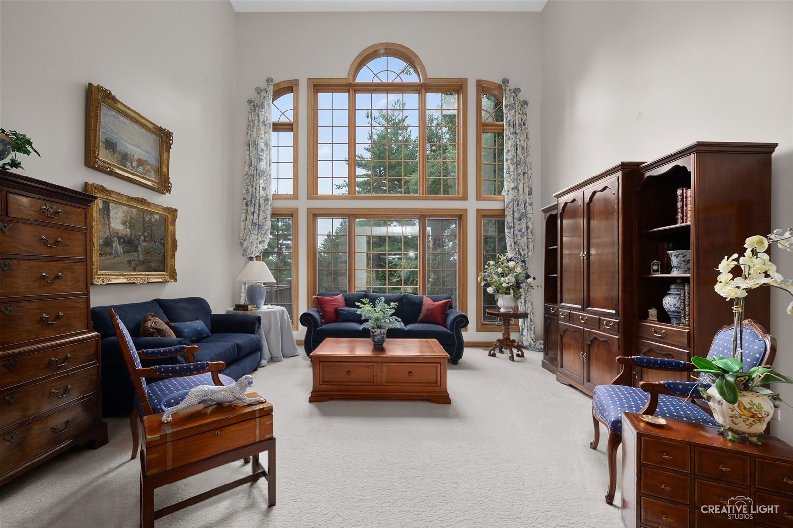 3293 Oak Knoll Road Carpentersville, IL 60110 - Photo 5 of 44 a living room with furniture a flat screen tv and a floor to ceiling window