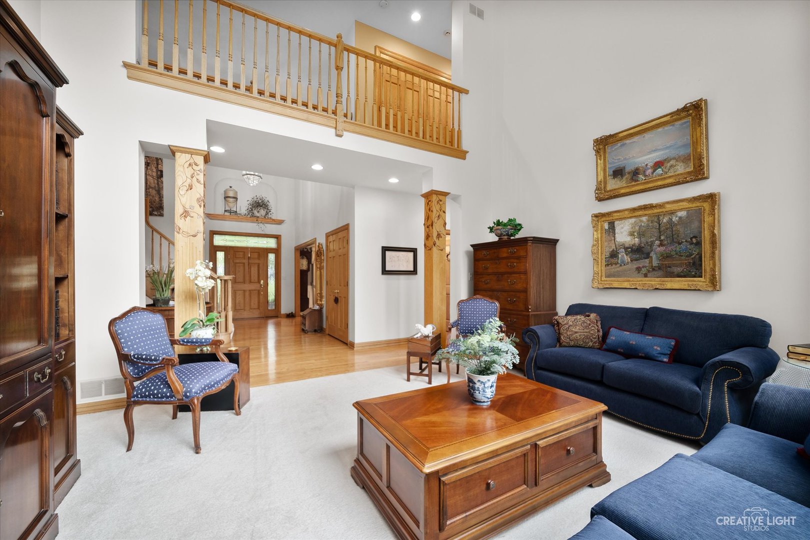 3293 Oak Knoll Road Carpentersville, IL 60110 - Photo 6 of 44 a living room with furniture a rug and a wall painting