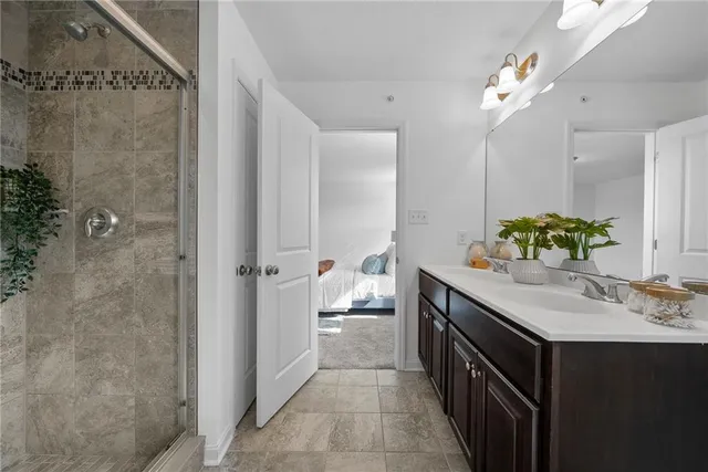 a bathroom with a double vanity sink and a mirror