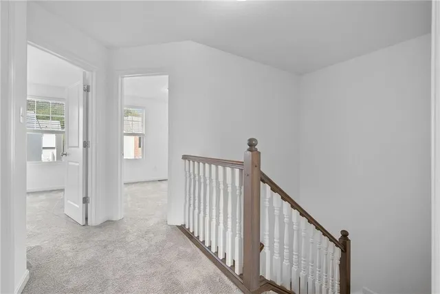 a view of a hallway with windows