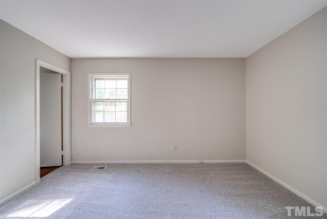 7408 Mine Shaft Road Raleigh, NC 27615 - Photo 11 of 20 an empty room with a window
