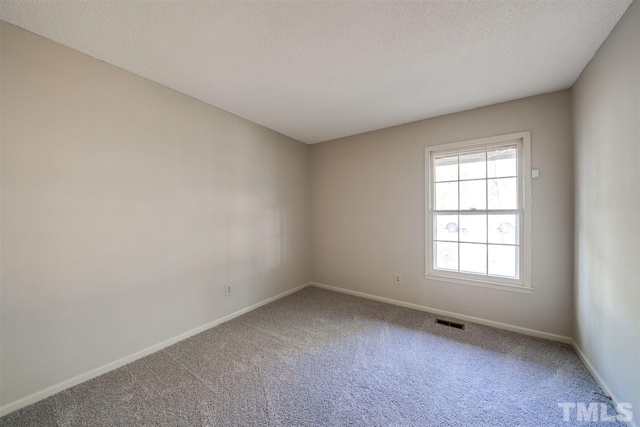 7408 Mine Shaft Road Raleigh, NC 27615 - Photo 8 of 20 an empty room with a window