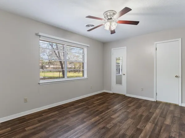 a view of an empty room with a window