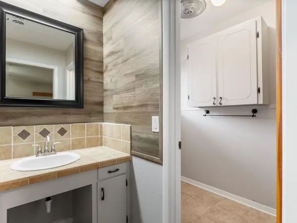 a bathroom with a sink and a mirror