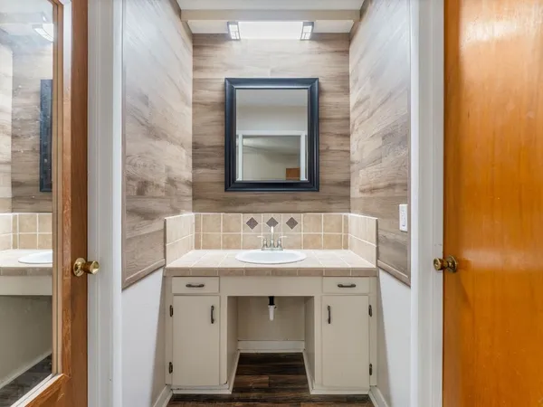 a bathroom with a sink and a mirror