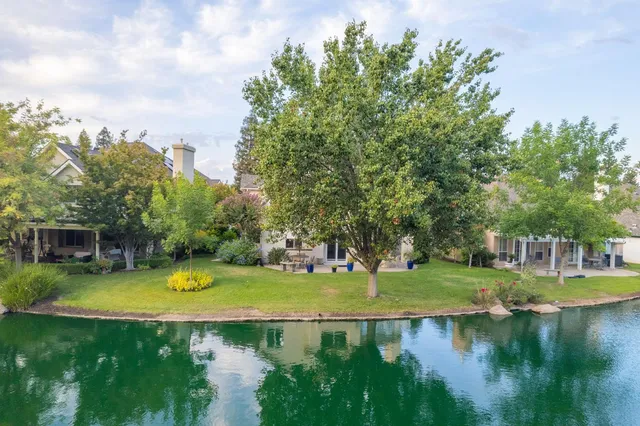 a view of a lake with lots of green space
