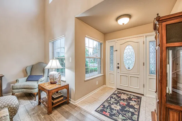 a view of entryway with wooden floor and stairs