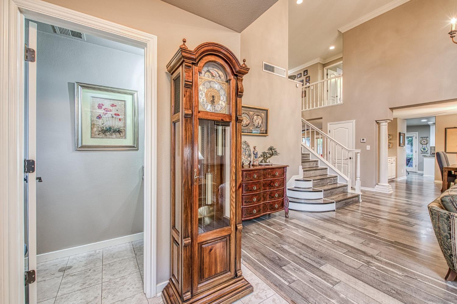 3077 West Pembrook Loop Fresno, CA 93711 - Photo 17 of 56 a view of entryway with wooden floor and stairs