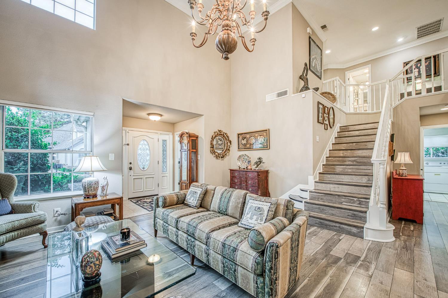 3077 West Pembrook Loop Fresno, CA 93711 - Photo 20 of 56 a living room with furniture and wooden floor