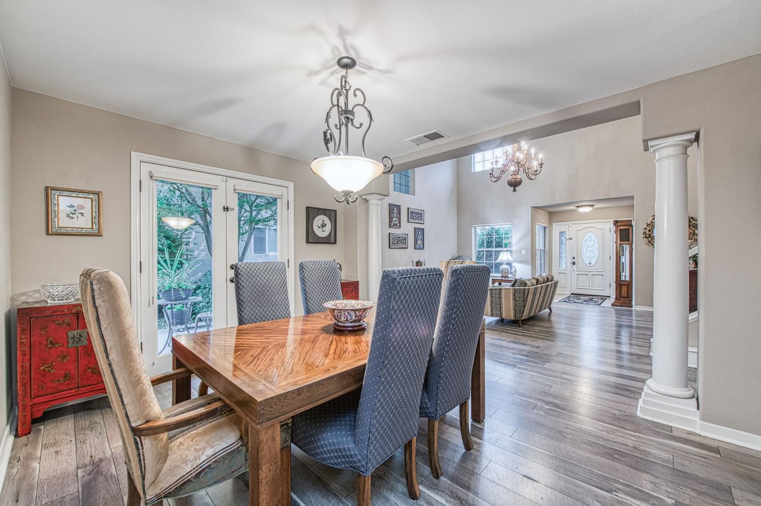 3077 West Pembrook Loop Fresno, CA 93711 - Photo 24 of 56 a view of a dining room with furniture window and wooden floor