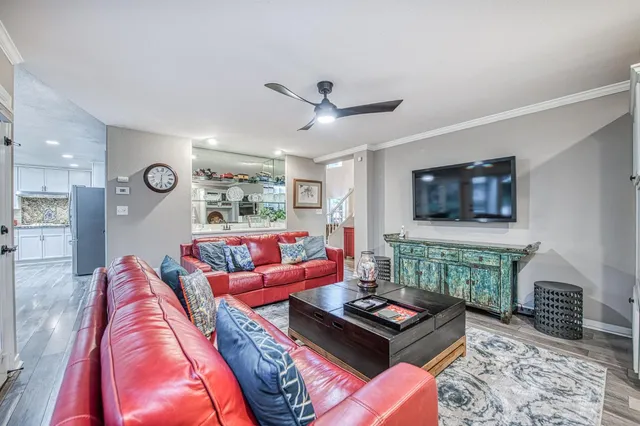 a kitchen with stainless steel appliances granite countertop a sink and wooden cabinets
