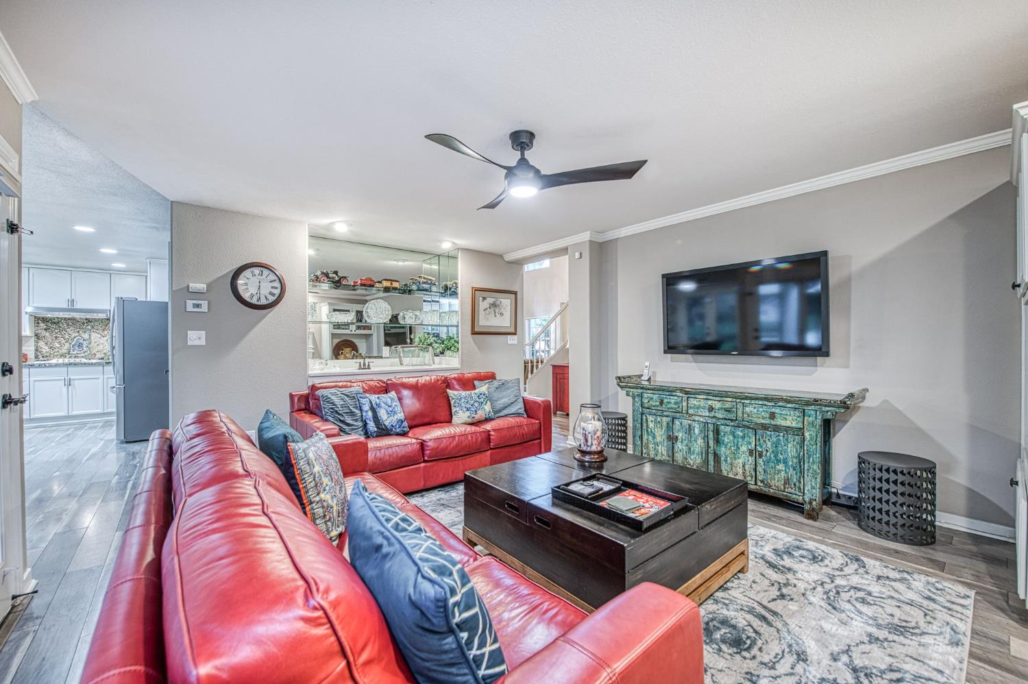 3077 West Pembrook Loop Fresno, CA 93711 - Photo 27 of 56 a living room with furniture and a flat screen tv