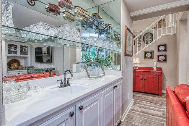 a view of a livingroom with furniture window and wooden floor