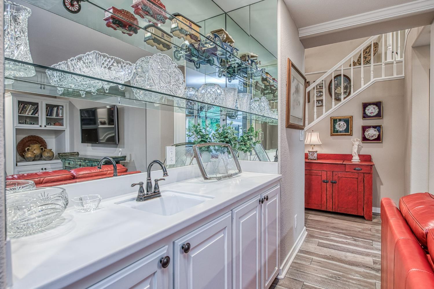 3077 West Pembrook Loop Fresno, CA 93711 - Photo 29 of 56 a kitchen with stainless steel appliances granite countertop a sink and wooden cabinets