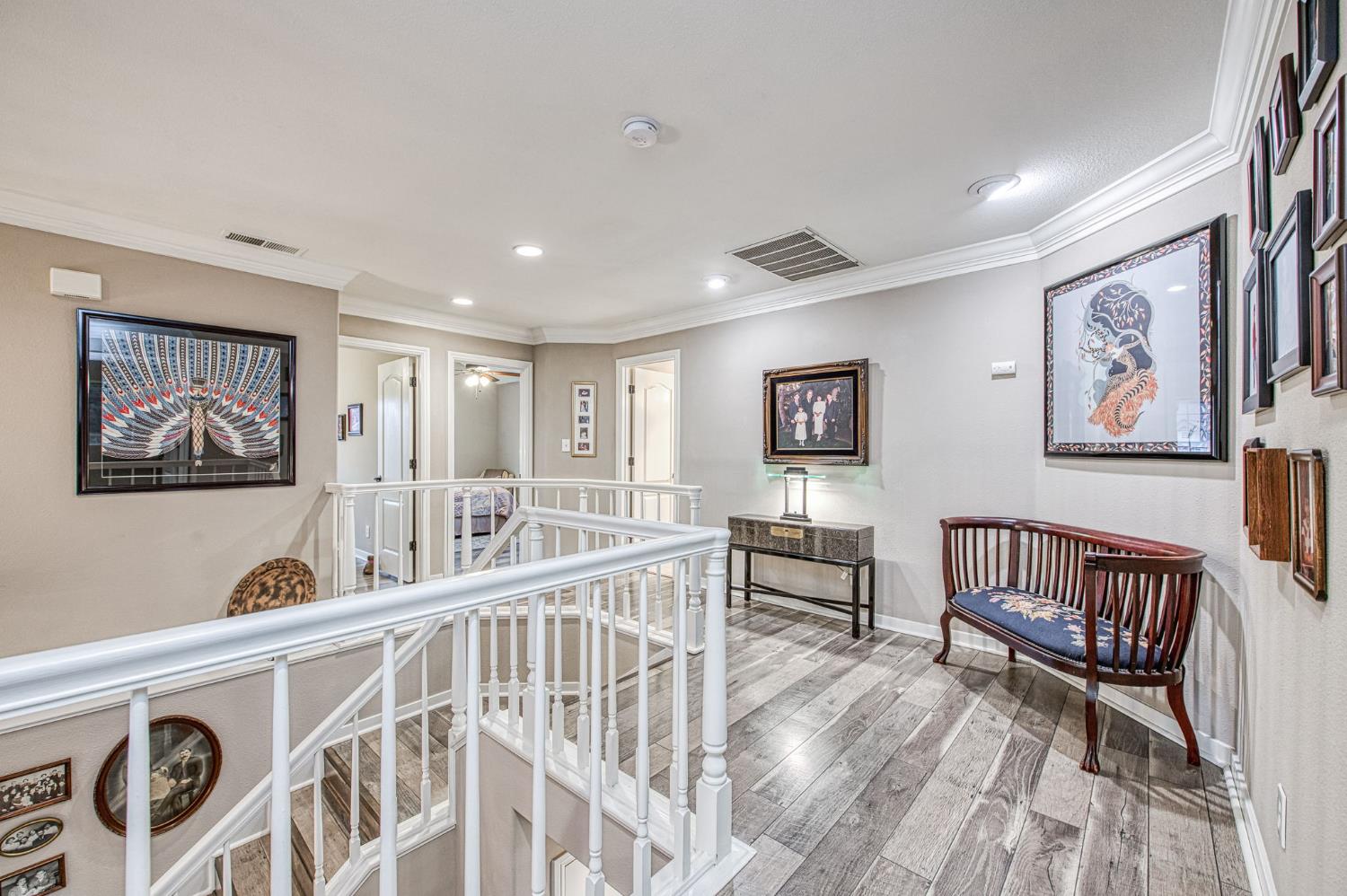 3077 West Pembrook Loop Fresno, CA 93711 - Photo 36 of 56 a living room with furniture and a wooden floor