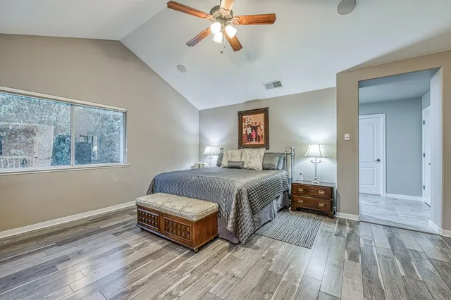 a view of a room that has a bed and a window