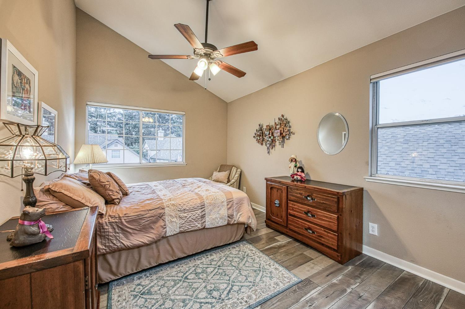 3077 West Pembrook Loop Fresno, CA 93711 - Photo 50 of 56 a bedroom with a bed and wooden floor