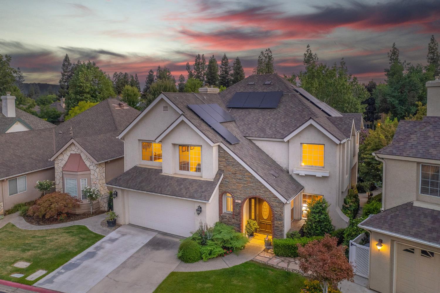 3077 West Pembrook Loop Fresno, CA 93711 - Photo 53 of 56 a view of a house with a yard and potted plants