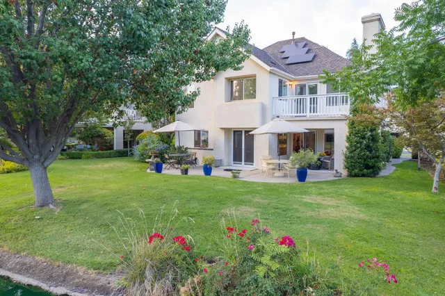a view of a house with a yard and plants