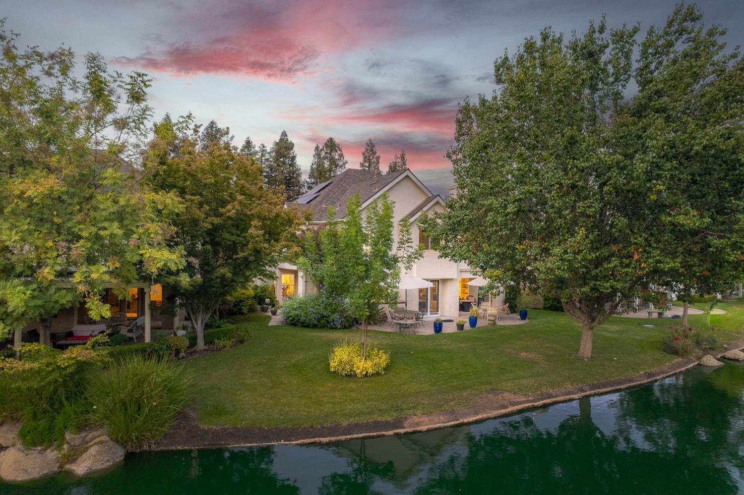 3077 West Pembrook Loop Fresno, CA 93711 - Photo 10 of 56 a view of house with garden space and trees
