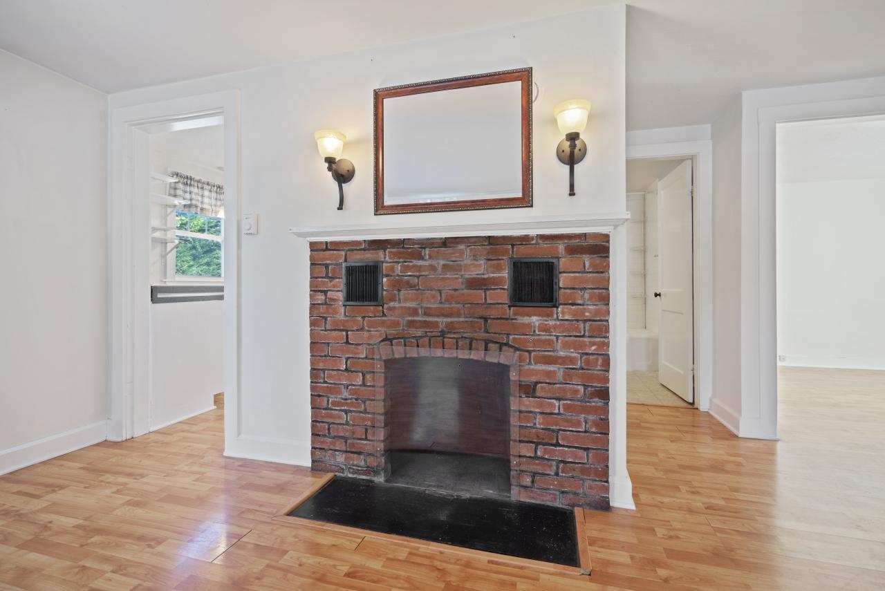 59 Fire Station Road Osterville, MA 02655 - Photo 7 of 31 a view of an empty room with wooden floor and a fireplace