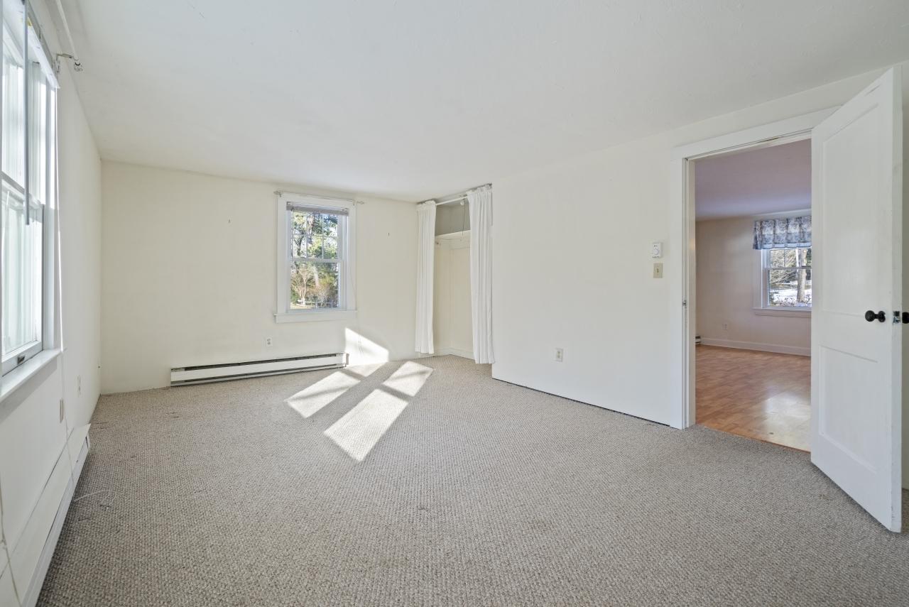 59 Fire Station Road Osterville, MA 02655 - Photo 9 of 31 an empty room with windows and closet