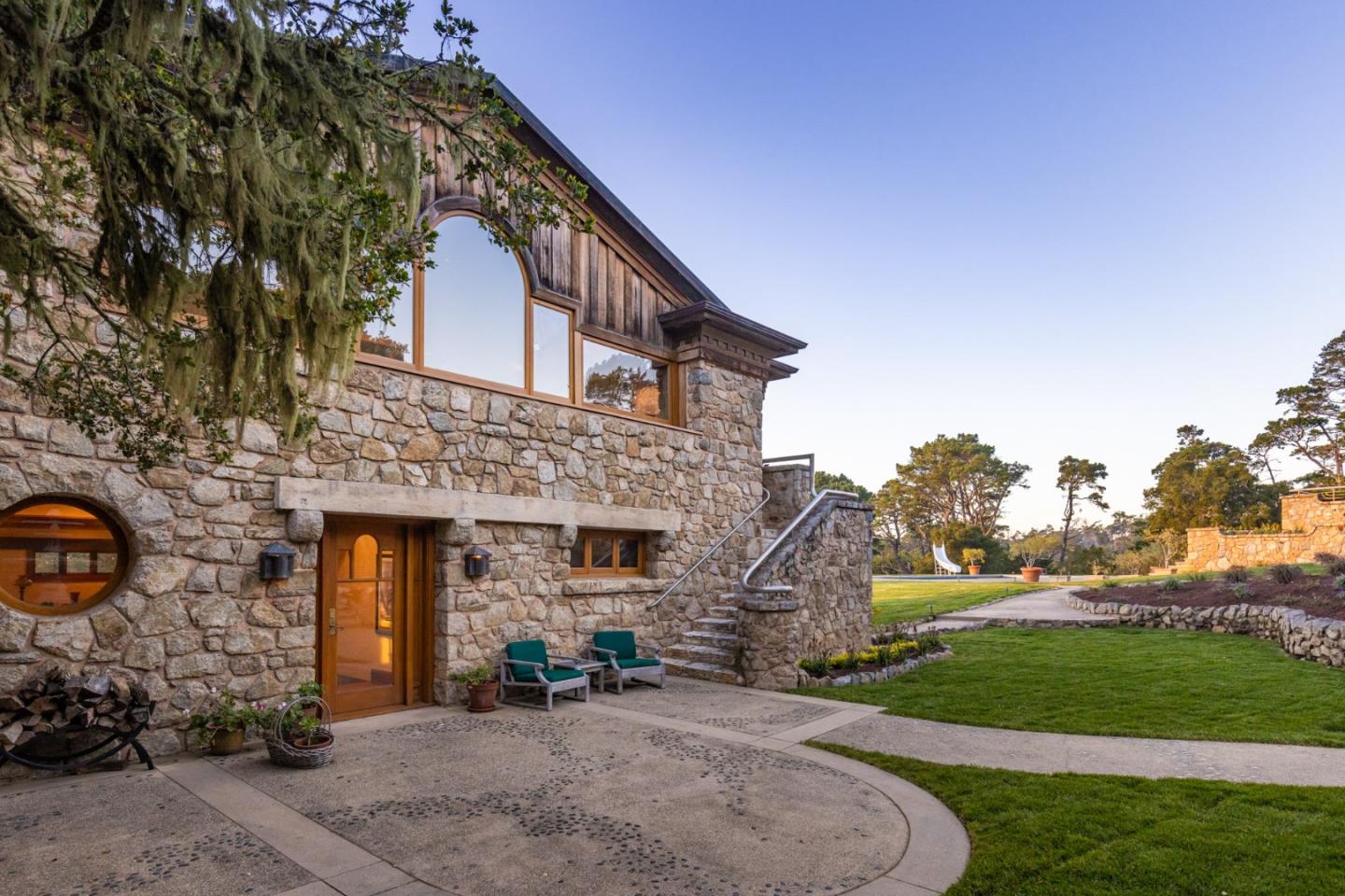 72 Fern Canyon Road Carmel, CA 93923 - Photo 41 of 66 a front view of a house with a yard and garage