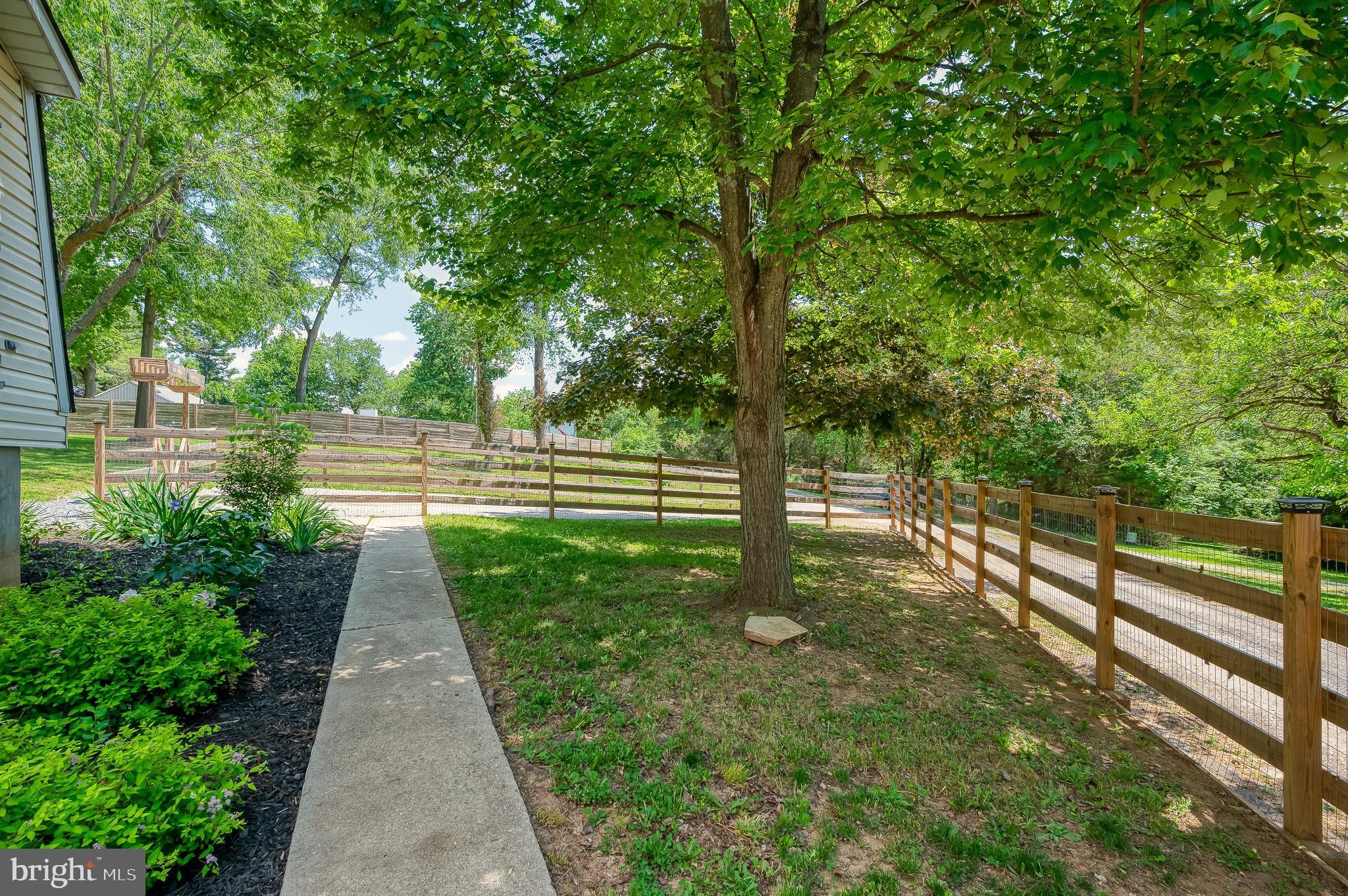 305 Crowl Road Westminster, MD 21158 - Photo 49 of 55 a view of a garden with large trees