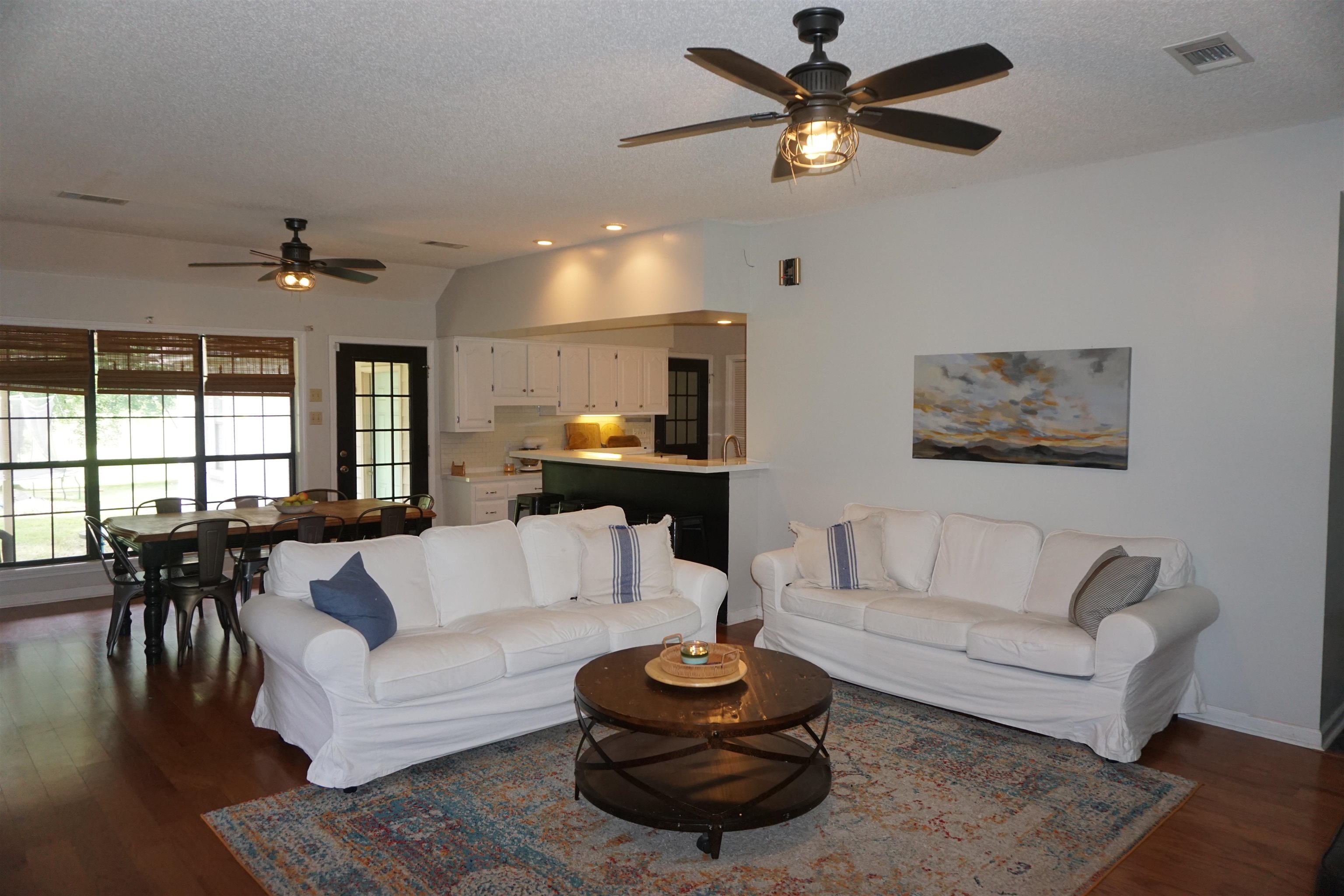 3780 Meade Lake Road Millington, TN 38053 - Photo 7 of 40 Living room with ceiling fan, dark wood-style floors, lofted ceiling, and a textured ceiling